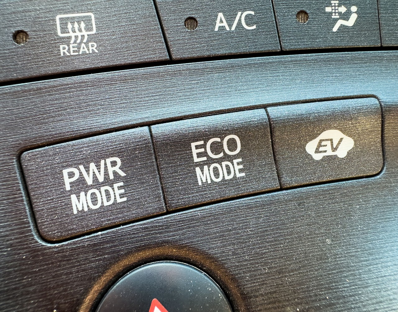 Close up view of a PHEV dashboard looking at the various power modes